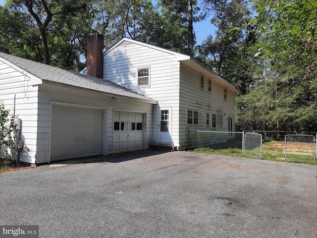 view of side of property featuring a garage