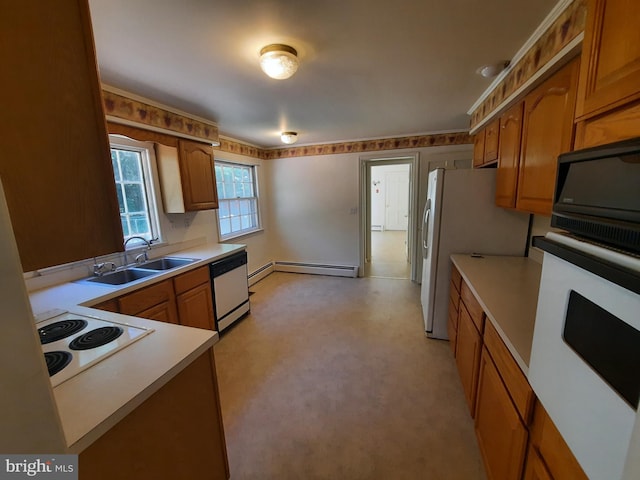 kitchen featuring white appliances, sink, and baseboard heating