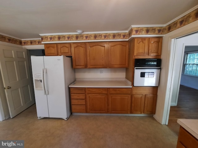 kitchen with white appliances and ornamental molding