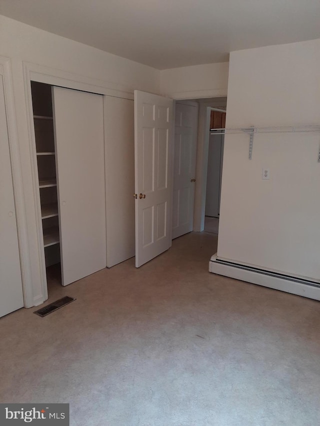 unfurnished bedroom with baseboard heating