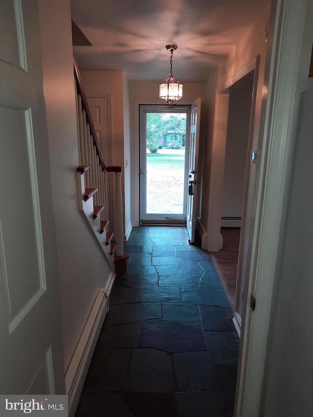 entryway featuring a baseboard heating unit