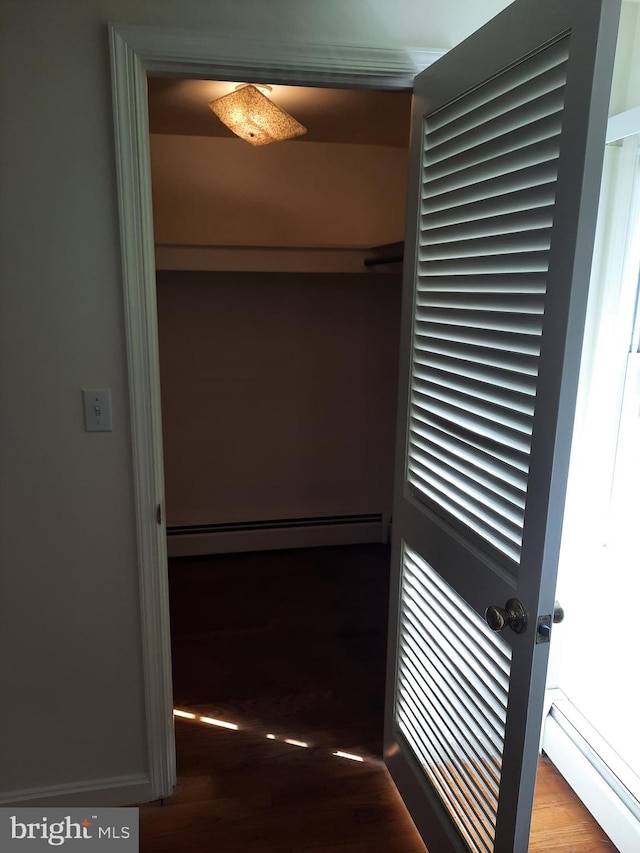 closet with a baseboard heating unit