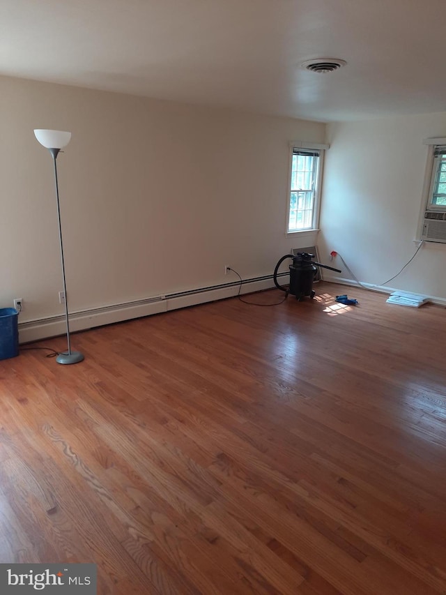 unfurnished room featuring hardwood / wood-style flooring