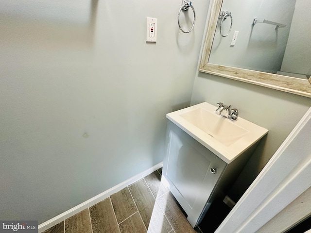 bathroom featuring wood-type flooring and sink