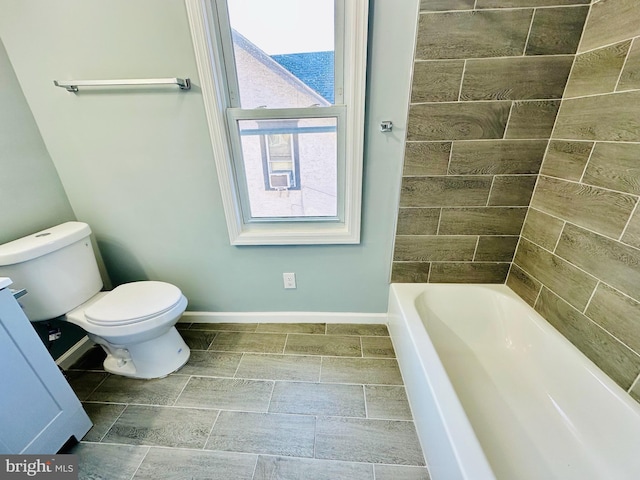 bathroom with toilet and a bathtub