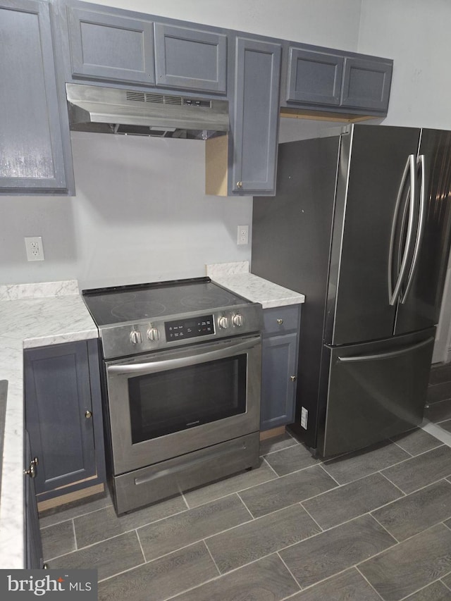 kitchen with gray cabinetry and stainless steel appliances