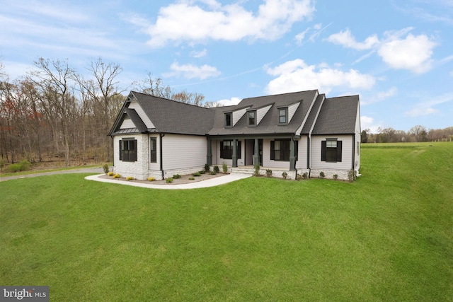 view of front of home with a porch and a front yard