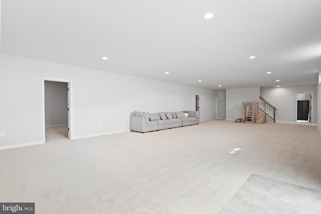 unfurnished living room featuring light colored carpet