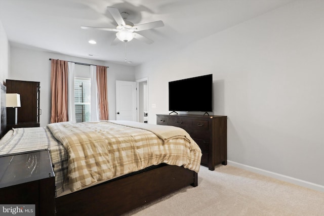 bedroom with light colored carpet and ceiling fan