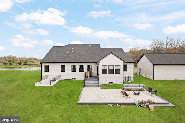 rear view of house with a yard and an outdoor hangout area