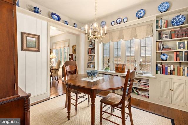 dining space featuring a chandelier and hardwood / wood-style flooring