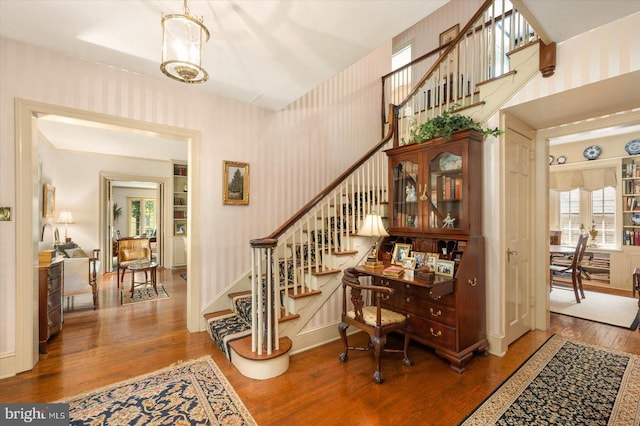 stairs featuring hardwood / wood-style flooring