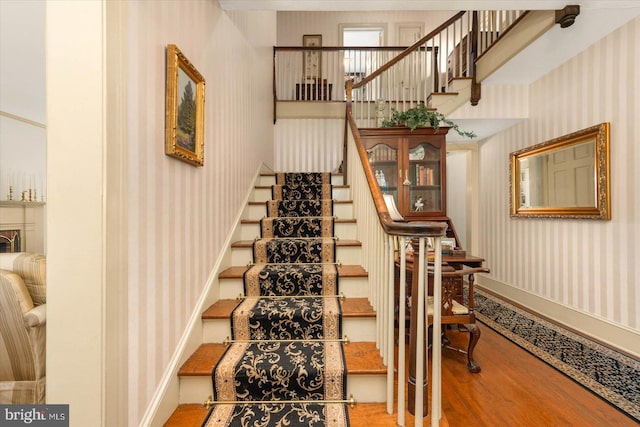 stairway featuring wood-type flooring