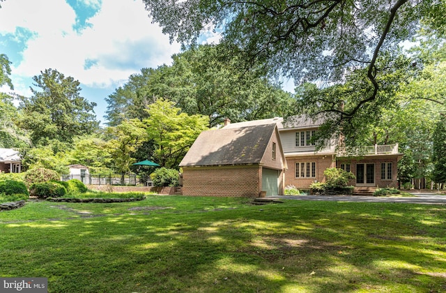 view of front of property with a garage and a front yard