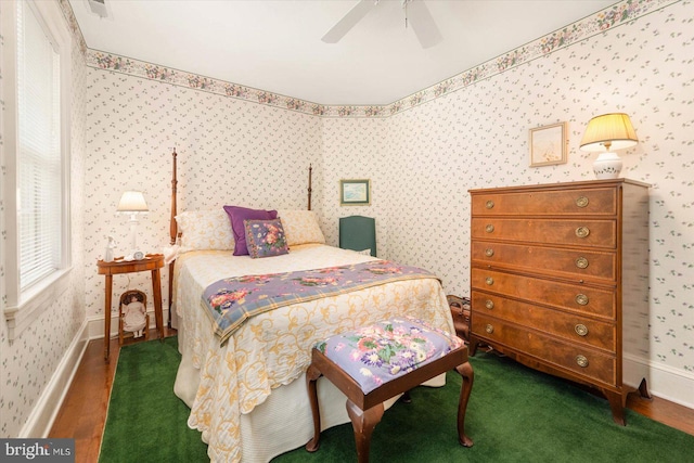 bedroom featuring ceiling fan and hardwood / wood-style flooring