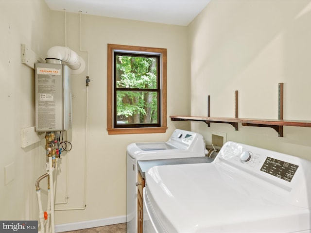 washroom featuring washer and dryer and tankless water heater