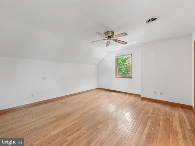 bonus room with ceiling fan, light hardwood / wood-style floors, and vaulted ceiling