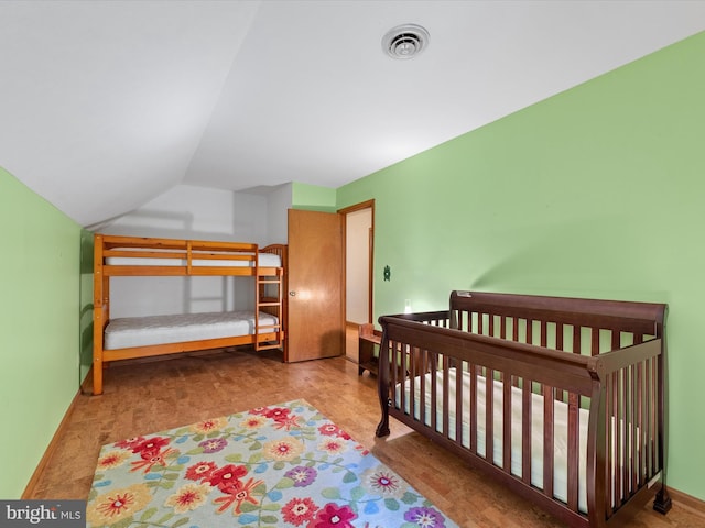 bedroom with lofted ceiling