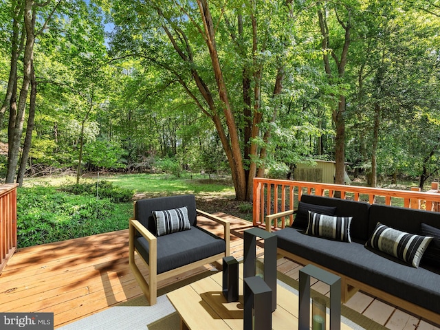 wooden deck featuring outdoor lounge area