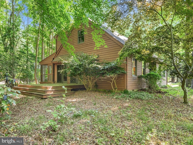 view of home's exterior with a deck