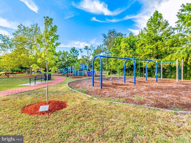 view of jungle gym featuring a lawn