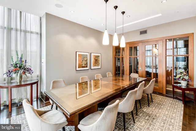 dining space with recessed lighting, visible vents, and wood finished floors