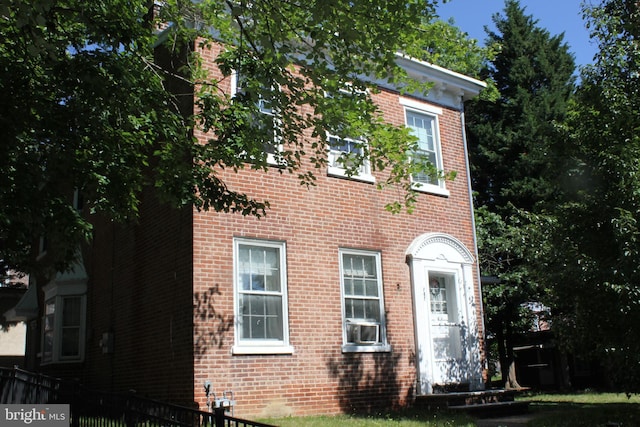 view of side of property featuring cooling unit