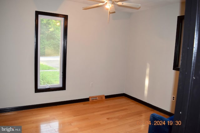 unfurnished room with light hardwood / wood-style floors and ceiling fan