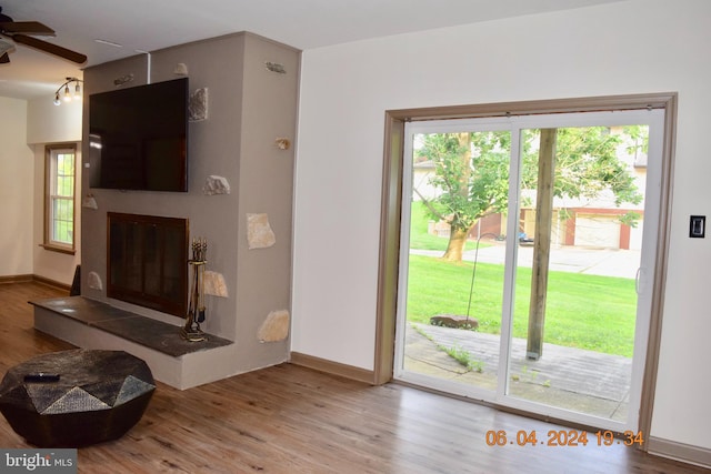 entryway with light hardwood / wood-style flooring and ceiling fan