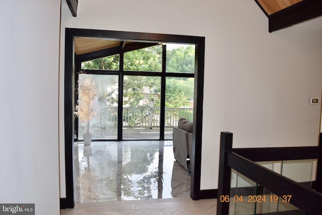 entryway featuring wooden ceiling and lofted ceiling