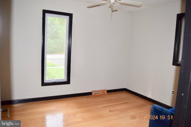 empty room featuring ceiling fan and light wood-type flooring