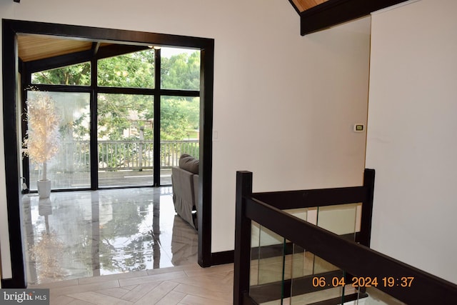 corridor featuring vaulted ceiling with beams and light parquet flooring