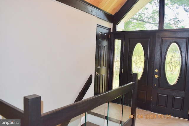 foyer with vaulted ceiling and wooden ceiling