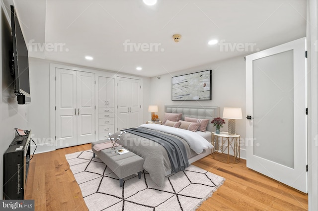 bedroom with light hardwood / wood-style flooring and a closet