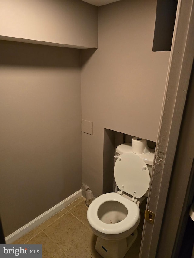 bathroom featuring tile patterned floors and toilet