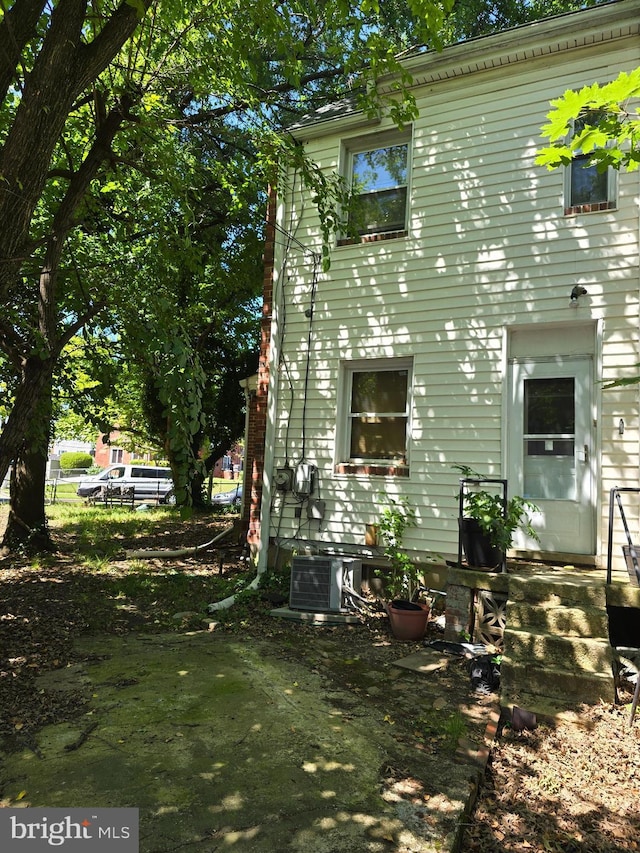 view of property exterior with central AC unit