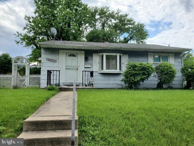 view of front of home with a front yard