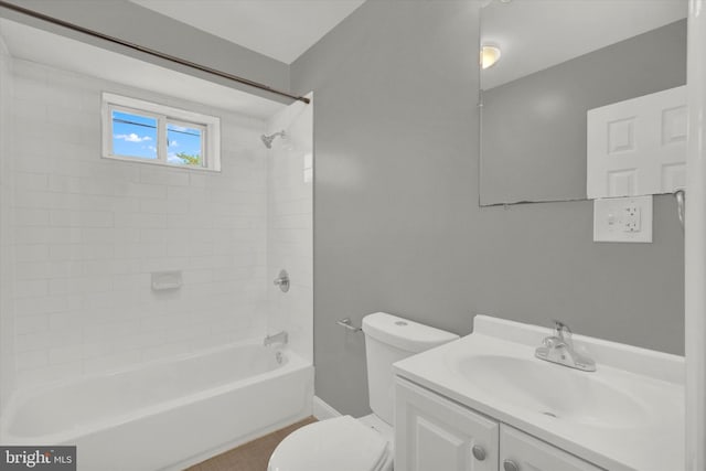 full bathroom featuring toilet, vanity, and tiled shower / bath