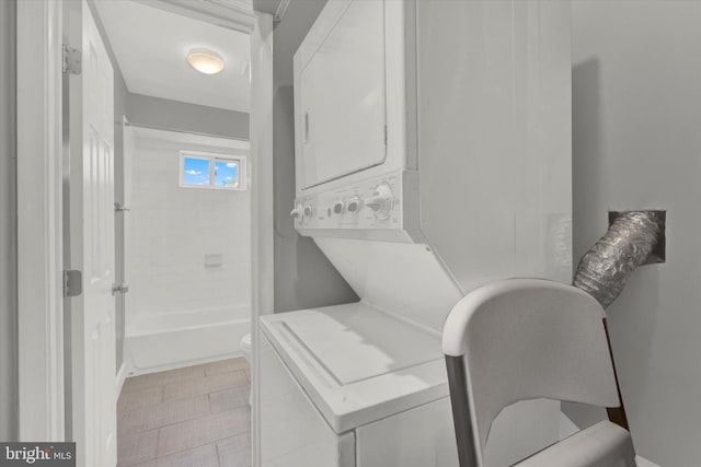 laundry area featuring stacked washer and clothes dryer