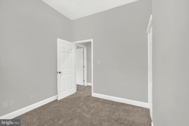 empty room featuring carpet flooring