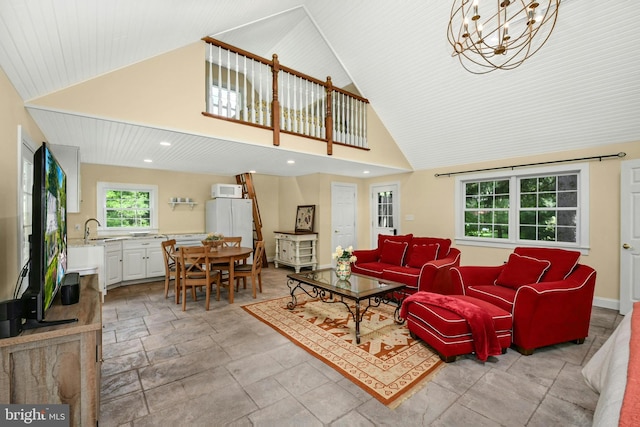 living room with sink, high vaulted ceiling, wooden ceiling, and a notable chandelier