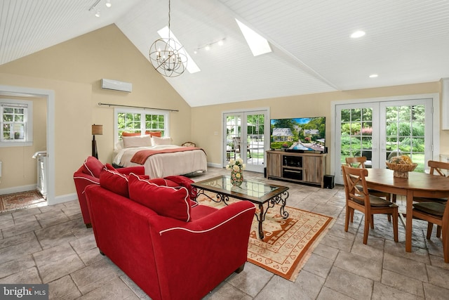 living room with a chandelier, french doors, high vaulted ceiling, and a wall unit AC