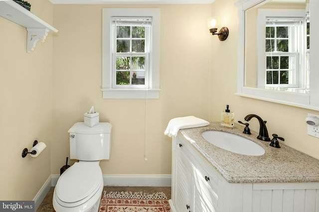 bathroom featuring vanity and toilet