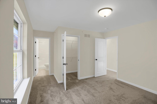 84 Limerick Ln, Selinsgrove, PA 17870 - unfurnished bedroom featuring carpet floors, baseboards, a closet, and a walk in closet