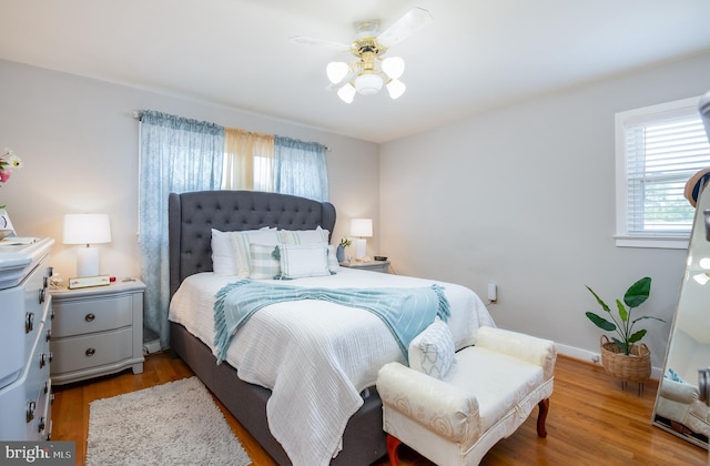 bedroom featuring ceiling fan and wood-type flooring