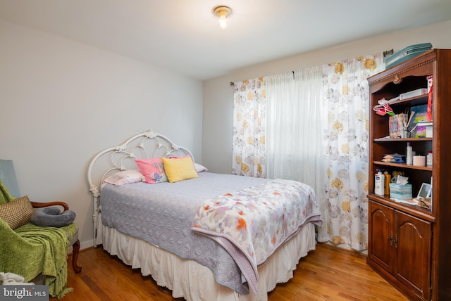 bedroom featuring hardwood / wood-style flooring