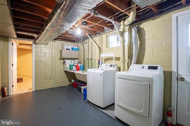 washroom with washer and dryer