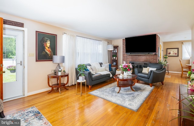 living room featuring hardwood / wood-style floors and a fireplace