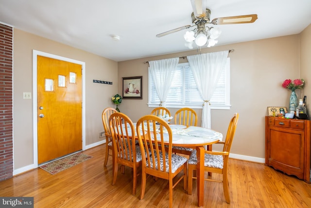 dining area featuring ceiling fan and light hardwood / wood-style floors