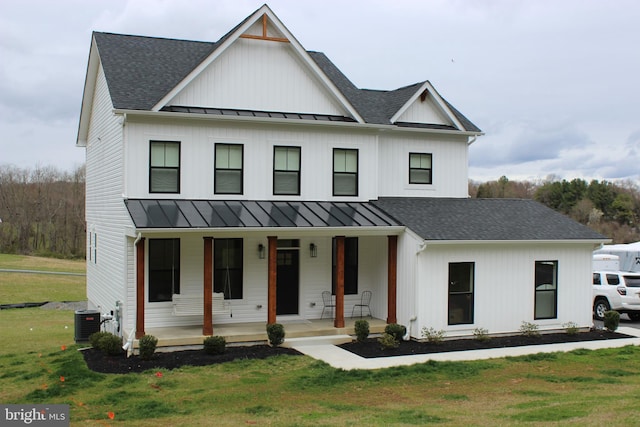 modern inspired farmhouse with a front yard, a porch, and central air condition unit